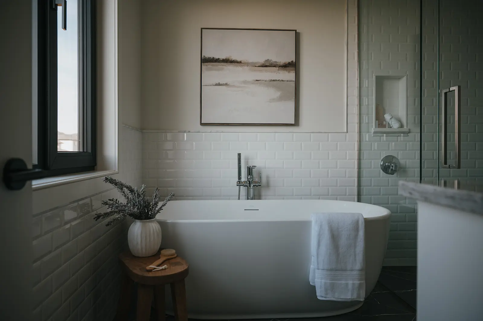 custom home bathroom in EdgeWater Estates in Kilworth with freestanding tub by Woodfield Design + Build