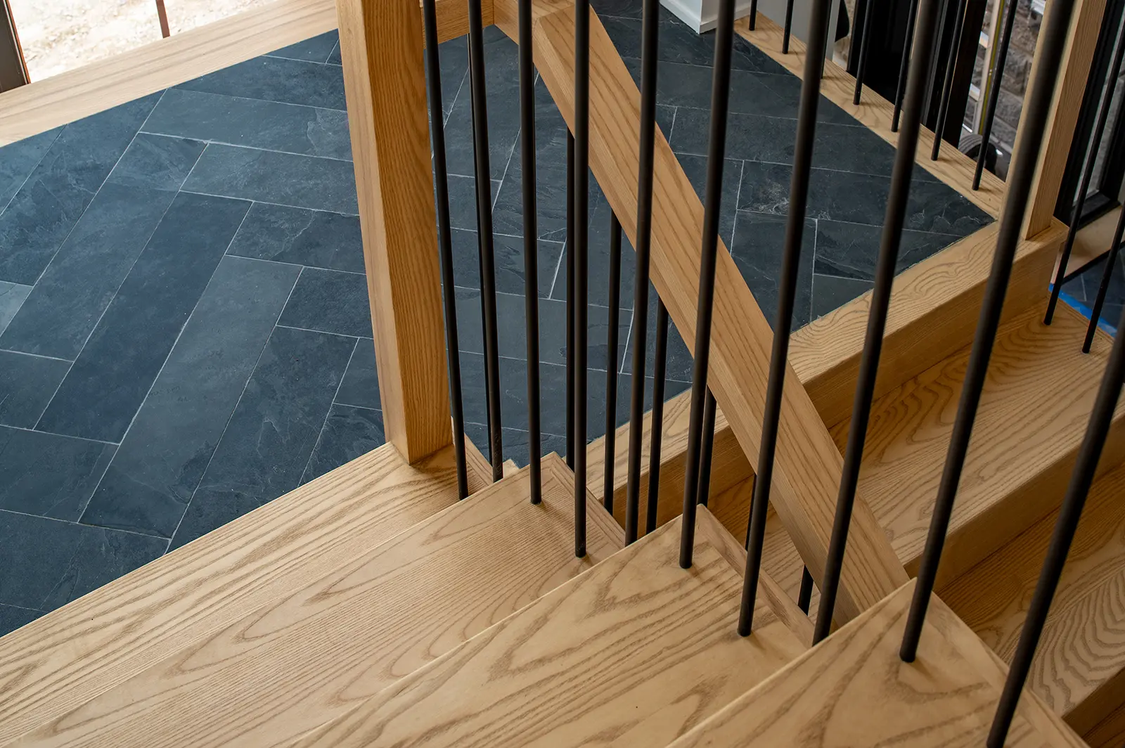 Custom wood staircase detail in a modern Woodfield Design + Build home