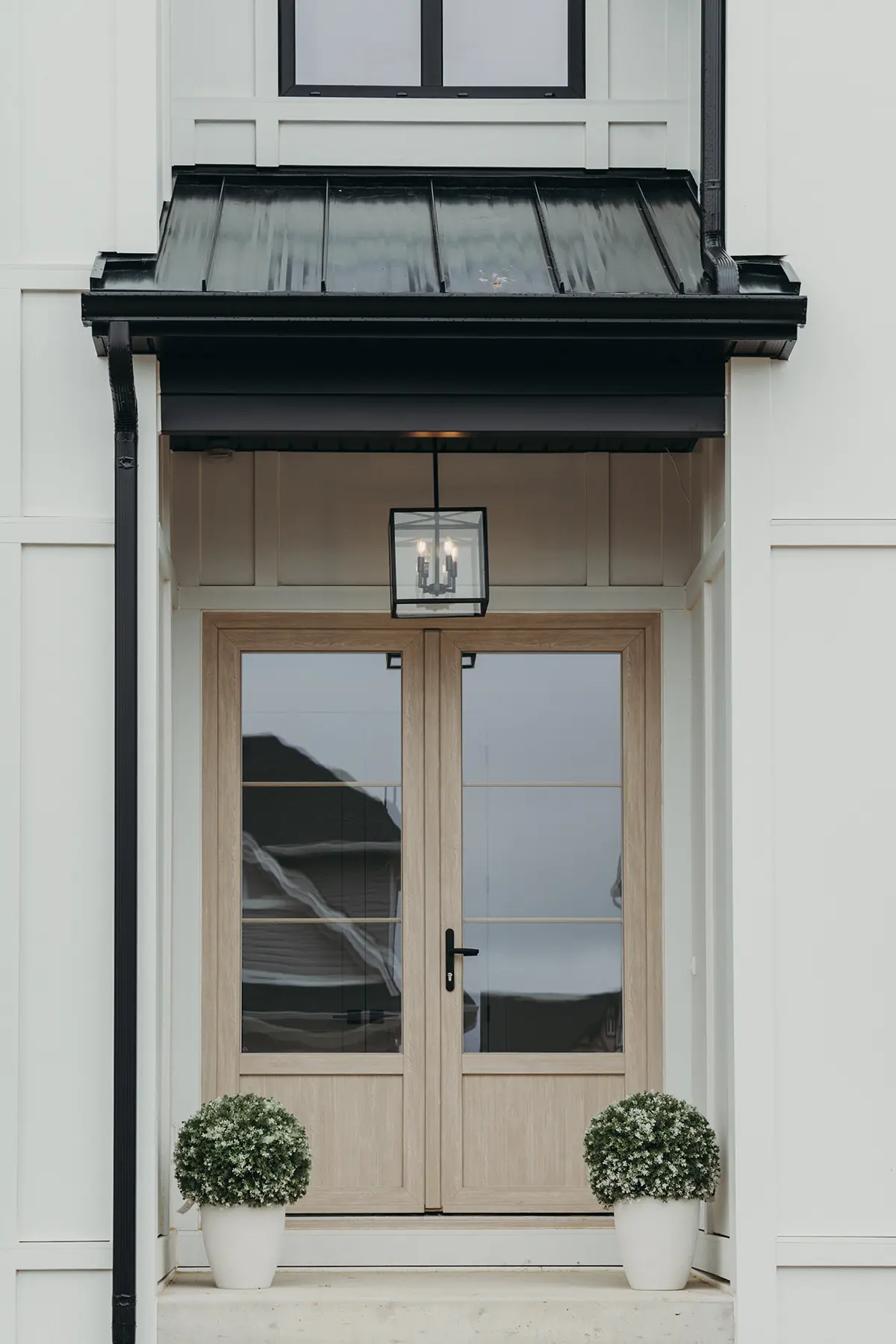 Custom home exterior showcasing craftsmanship by Woodfield Design + Build